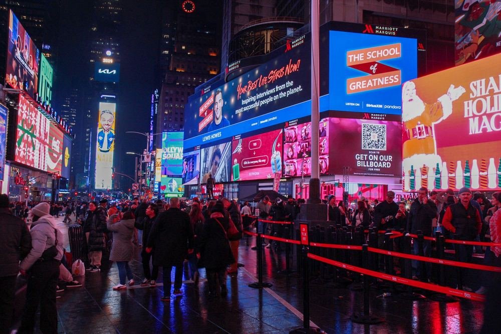Times Square at night, lit by billboards