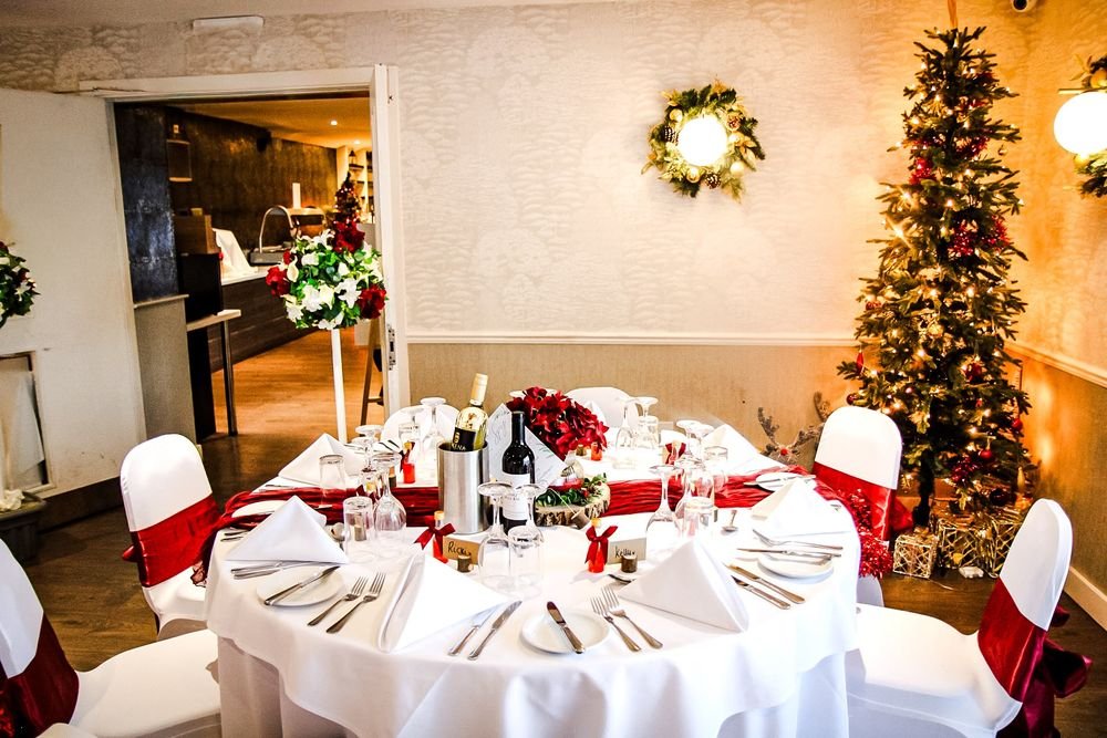 Wedding breakfast room dressed in red and white for a winter wedding